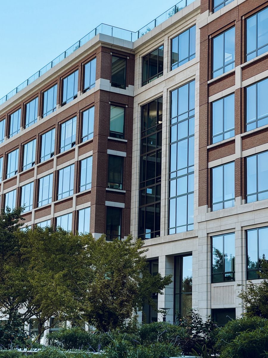 Contemporary commercial building surrounded by landscaped grounds